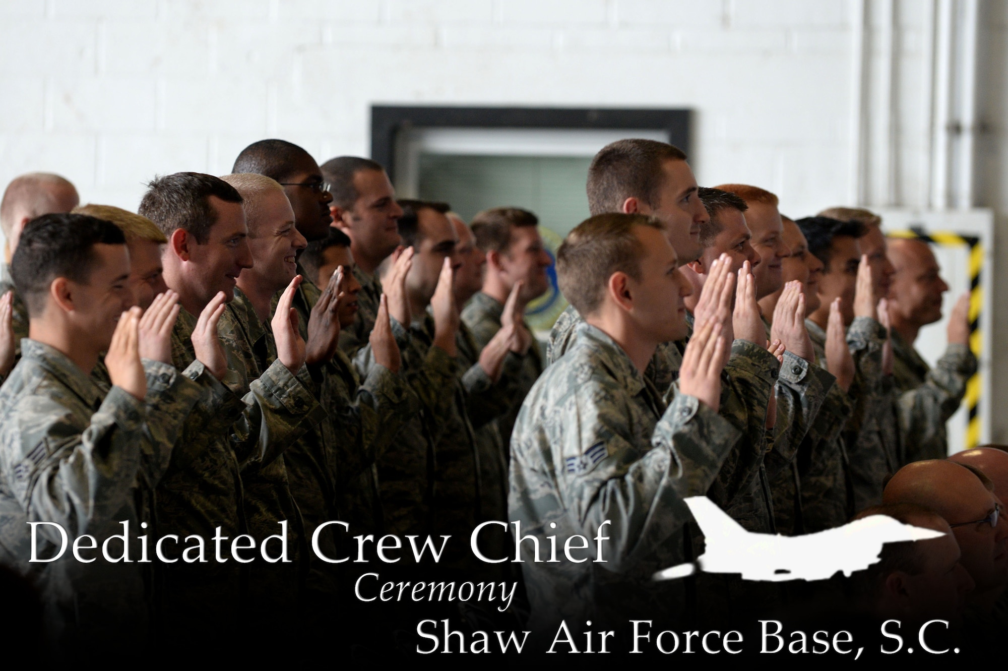 U.S. Air Force crew chiefs assigned to the 20th Aircraft Maintenance Squadron raise their right hand while reciting the Crew Chief Oath during the Dedicated Crew Chief Ceremony at Shaw Air Force Base, S.C., Sept. 29, 2014. During the ceremony crew chiefs were recognized for their dedication and hard work. Every F-16CM Fighting Falcon has a dedicated crew chief assigned who is trusted with the care and maintenance of the jet. At the ceremony the Airmen received a coin from their respective commanders, a certificate certifying them as dedicated crew chiefs, and new maintenance overalls to designate them as dedicated crew chiefs while working on the flightline. (U.S. Air Force photo illustration by Airman 1st Class Michael Cossaboom/Released)