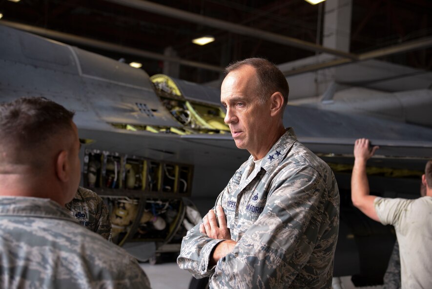 U.S. Air Force Maj. Gen. John Cooper, Air Combat Command director of logistics, discusses the repairs done to F-16CM Fighting Falcons with a 20th Aircraft Maintenance Squadron Airman at Shaw Air Force Base, S.C., Sept. 25, 2014. Cooper is a maintenance officer by trade, beginning his career as a munitions officer assigned to Hurlburt Field, Fla., in 1983. (U.S. Air Force photo by Airman 1st Class Jonathan Bass/Released)