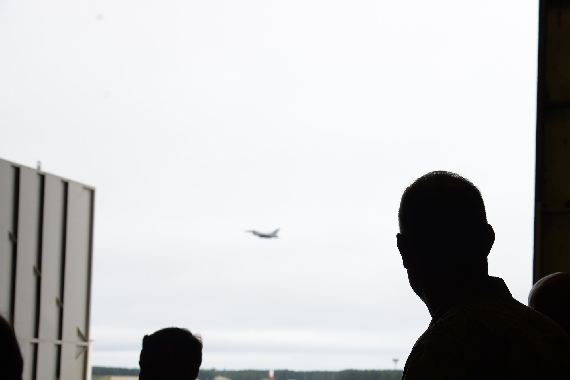 U.S. Air Force Maj. Gen. John Cooper, Air Combat Command director of logistics, watches an F-16CM Fighting Falcon take off at Shaw Air Force Base, S.C., Sept. 25, 2014. Cooper visited Shaw to meet with Airmen and see how they have accomplished the mission without having the proper equipment. (U.S. Air Force photo by Airman 1st Class Jonathan Bass/Released)