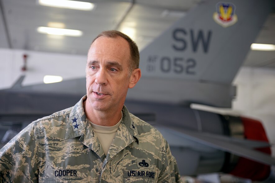 U.S. Air Force Maj. Gen. John Cooper, Air Combat Command director of logistics, asks a question to an Airman assigned to the 20th Equipment Maintenance Squadron corrosion control flight at Shaw Air Force Base, S.C., Sept. 25, 2014. The corrosion control flight worked around defective equipment since 2012 while still meeting the needs of the 20th Fighter Wing’s mission, to provide combat ready airpower and airmen to meet any challenge, anytime, anywhere. (U.S. Air Force photo by Airman 1st Class Jonathan Bass/Released)