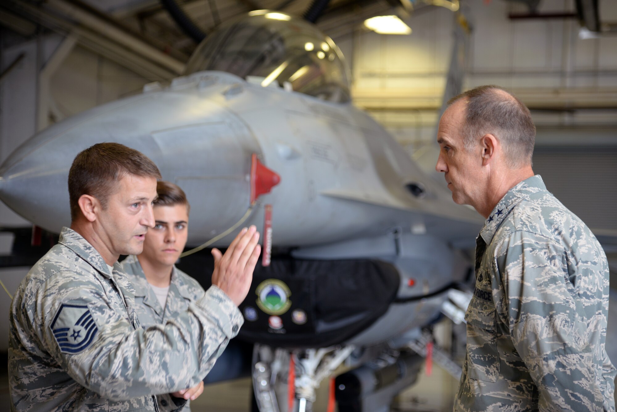 U.S. Air Force Master Sgt. Gregory Griffith, 20th Component Maintenance Squadron aircraft fuels systems section chief, discusses the solutions to the manning issues that the fuels systems shop has implemented with Maj. Gen. John Cooper, Air Combat Command director of logistics, at Shaw Air Force Base, S.C., Sept. 25, 2014. To counter the shop’s manning, increased special training was implemented, along with new fueling procedures. (U.S. Air Force photo by Airman 1st Class Jonathan Bass/Released) 