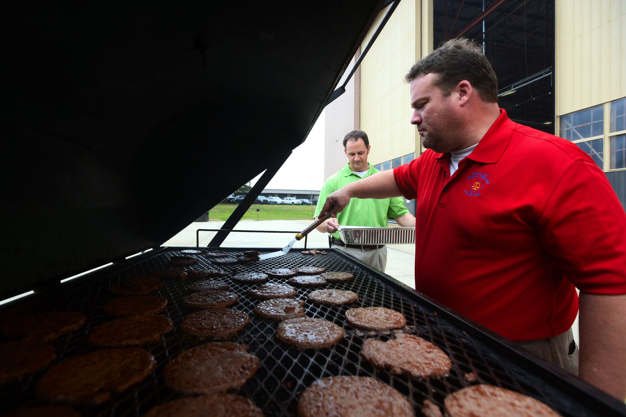 Eddie Donald, Sumter County Prosecutor employee, prepares hamburger patties during the 6th Annual Military Appreciation Picnic at Shaw Air Force Base, S.C., Sept. 26, 2014. More than 300 Team Shaw members attended the picnic. (U.S. Air Force photo by Airman 1st Class Jensen Stidham/Released) 