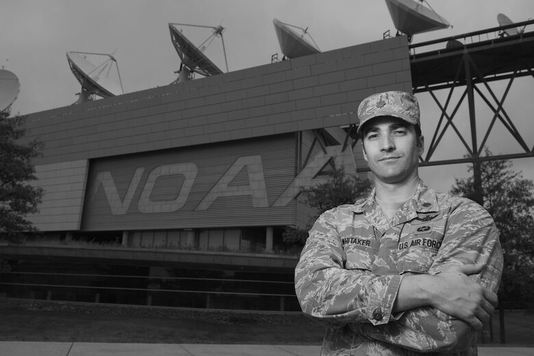 Maj. Jonathan Whitaker stands in front of the he National Oceanic and Atmospheric Administration’s satellite operations facility Sept. 26, 2014, in Suitland, Md. Whitaker is the commander of Detachment 1, 50th Space Operations Group, a small unit of four Air Force officers, who work with NOAA civilians on the Defense Meteorological Satellite Program – the only weather satellite system in the DOD. The seven-satellite constellation supplies weather data and imagery to the Air Force Weather agency as well as military and civilian organizations around the world. (U.S. Air Force photo/Senior Airman Alexander W. Riedel)