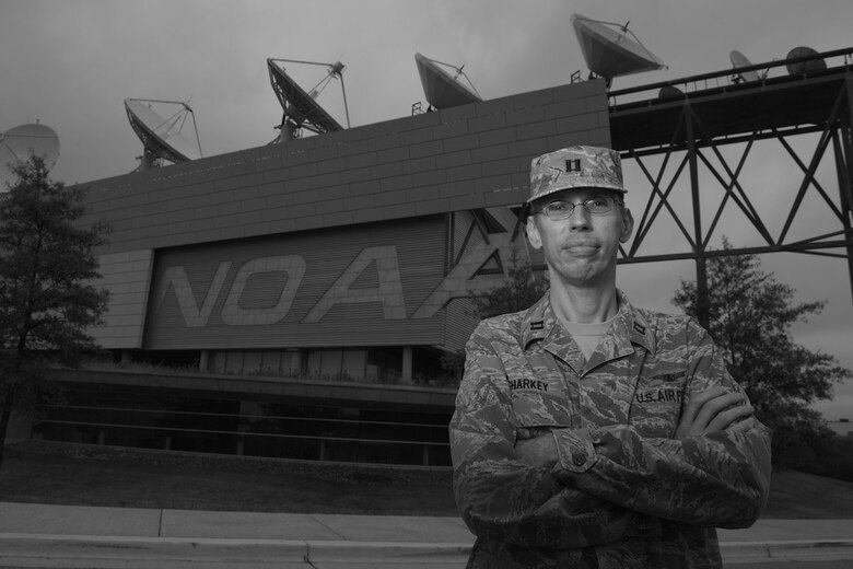 Capt. Nathaniel Sharkey stands in front of the National Oceanic and Atmospheric Administration’s satellite operations facility Sept. 26, 2014, in Suitland, Md. Sharkey is the director of operations for Detachment 1, 50th Space Operations Group. The geographically separated unit manages the Defense Meteorological Satellite Program – the only weather satellite system in the DOD – in cooperation with NOAA engineers and satellite operators. The seven-satellite constellation supplies weather data and imagery to the Air Force Weather agency as well as military and civilian organizations around the world. (U.S. Air Force photo/Senior Airman Alexander W. Riedel)