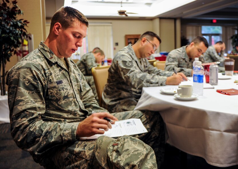 U.S. Air Force 2nd Lt. John Sambo, 23d Civil Engineer Squadron project programmer, takes notes during the Combined Federal Campaign kick-off training at Moody Air Force Base, Ga., Sept. 29, 2014. During Moody’s campaign period, which ends Dec. 12, individuals can make pledges to eligible non-profit organizations that provide health and human service benefits throughout the world.  (U.S. Air Force photo by Andrea Jenkins/Released)