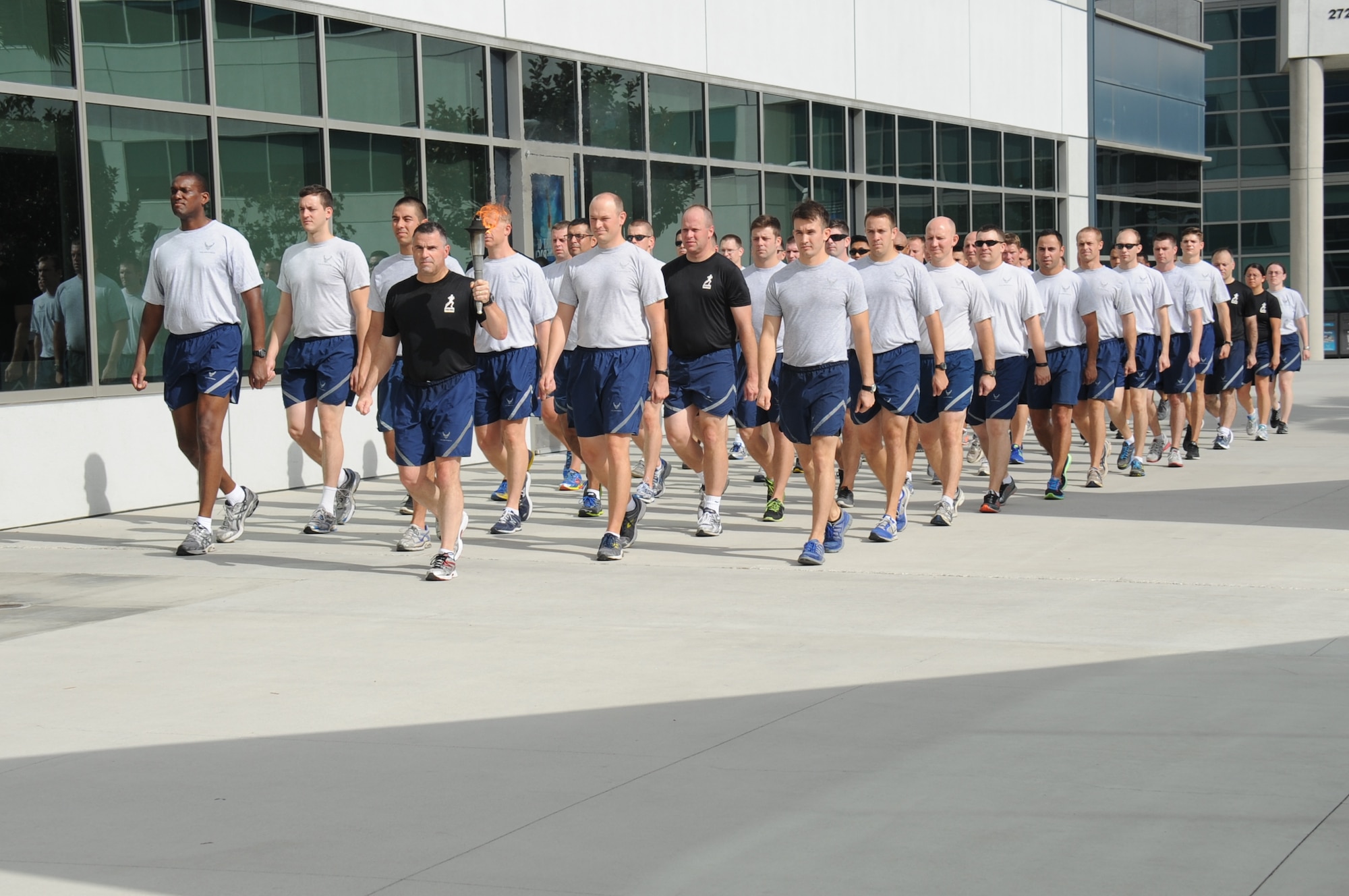 The Space and Missile Systems Center at Los Angeles Air Force Base, Calif., held its annual POW/MIA 24 hour Torch Relay, starting with a ceremony at the San Pedro Coast Guard Station, Sept. 18, 2014, where Coast Guard members ran the first leg, followed by LAAFB, then the Army and Navy from the MEPS Center in El Segundo through the South Bay Beach cities, to bring awareness about America’s POW/MIAs. The torch was carried around LAAFB’s track through the night culminating with a wreath laying ceremony at 9 a.m. on Friday, Sept. 19. (Photos by Joe Juarez, Sarah Corrice and Van Ha)