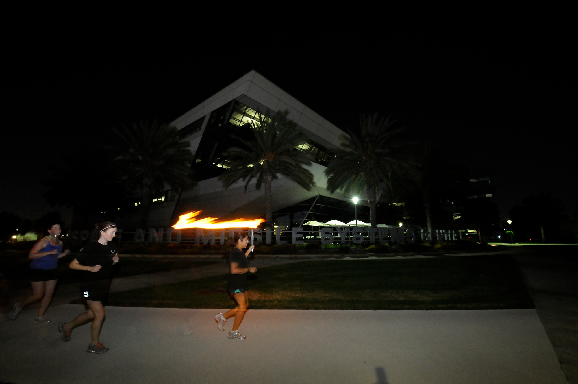 The Space and Missile Systems Center at Los Angeles Air Force Base, Calif., held its annual POW/MIA 24 hour Torch Relay, starting with a ceremony at the San Pedro Coast Guard Station, Sept. 18, 2014, where Coast Guard members ran the first leg, followed by LAAFB, then the Army and Navy from the MEPS Center in El Segundo through the South Bay Beach cities, to bring awareness about America’s POW/MIAs. The torch was carried around LAAFB’s track through the night culminating with a wreath laying ceremony at 9 a.m. on Friday, Sept. 19. (Photos by Joe Juarez, Sarah Corrice and Van Ha)