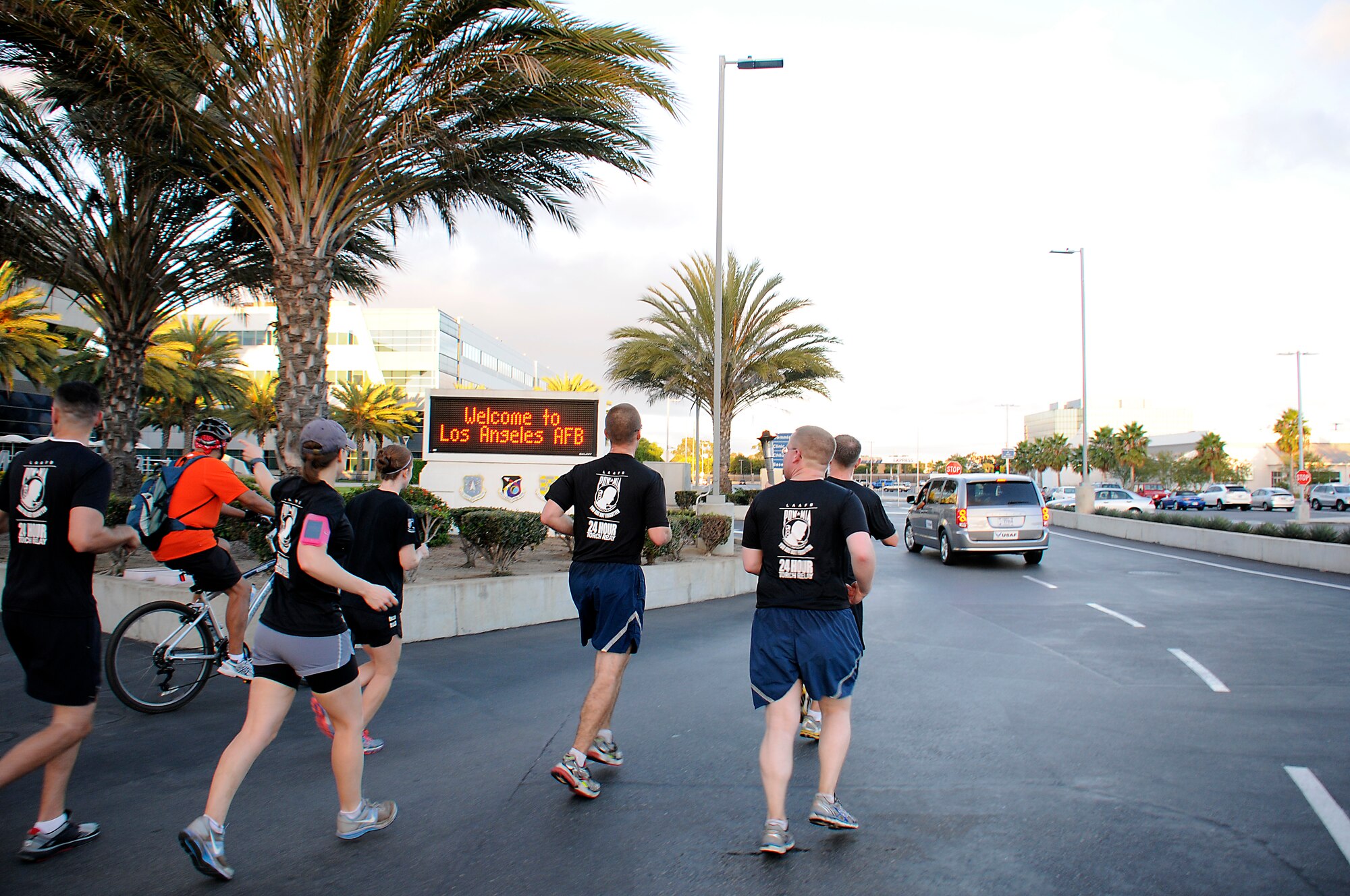 The Space and Missile Systems Center at Los Angeles Air Force Base, Calif., held its annual POW/MIA 24 hour Torch Relay, starting with a ceremony at the San Pedro Coast Guard Station, Sept. 18, 2014, where Coast Guard members ran the first leg, followed by LAAFB, then the Army and Navy from the MEPS Center in El Segundo through the South Bay Beach cities, to bring awareness about America’s POW/MIAs. The torch was carried around LAAFB’s track through the night culminating with a wreath laying ceremony at 9 a.m. on Friday, Sept. 19. (Photos by Joe Juarez, Sarah Corrice and Van Ha)
