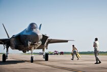 Staff Sgt. Wayne Singleton, 33rd Fighter Wing, marshals in an F-35A Lightning II at Duke Field, Fla.  The maintainers, typically stationed at Eglin Air Force Base, were there to support the aircraft before and after a joint multi-wing major accident response exercise.  (U.S. Air Force photo/Tech. Sgt. Sam King)