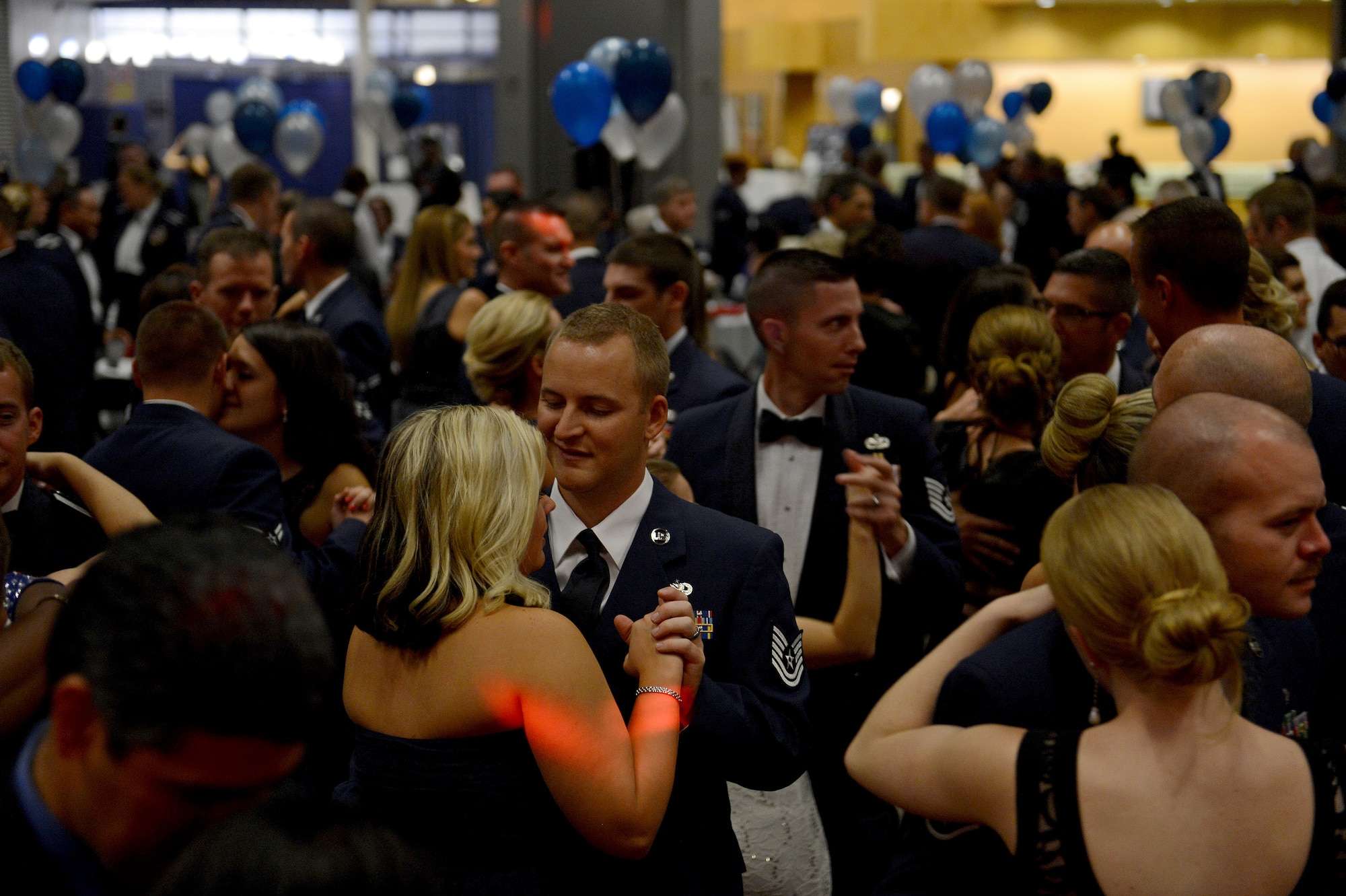 Attendees dance in celebration of the Air Force’s 67th birthday  Sept. 26, 2014, during the Air Force Ball at Clover Park Technical College, Lakewood, Wash. The night of celebration offered a social hour, toasts, a dinner, a presentation, a singing of the Air Force song and dancing throughout the night. (U.S. Air Force photo/Airman 1st Class Keoni Chavarria)