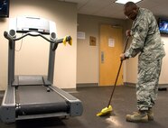 Senior Airman Kenneth Jackson, 919th Special Operations Logistics Readiness Squadron, sweeps the gym floor during the GI party Sept. 6 at Duke Field, Fla.  Airmen, from the 919th Special Operations Mission Support Group, came together to scrub down and clean up the Duke Field gym and fitness areas during the September unit training assembly.  (U.S. Air Force photo/Tech. Sgt. Jasmin Taylor)