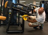 Tech. Sgt. John Branhof, 919th Special Operations Fore Support Squadron, cleans the exercise equipment during the GI party Sept. 6 at Duke Field, Fla.  Airmen, from the 919th Special Operations Mission Support Group, came together to scrub down and clean up the Duke Field gym and fitness areas during the September unit training assembly.  (U.S. Air Force photo/Tech. Sgt. Jasmin Taylor)