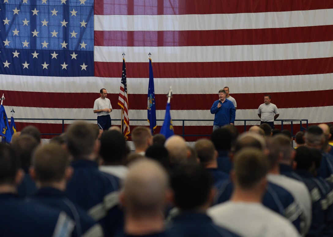 Dennis Wier, 28th Bomb Wing community support coordinator, discusses various physical activities available on base for Airmen to participate in during the Comprehensive Airman Fitness day in the Pride Hangar at Ellsworth Air Force Base, S.D., Sept. 30, 2014. Weir explained the details of each event during a wing commander’s call that began the CAF day, which focused on encouraging Airmen to adopt and sustain healthy behaviors needed to enhance overall physical health and wellness. (U.S. Air Force photo by Airman 1st Class Rebecca Imwalle/Released)