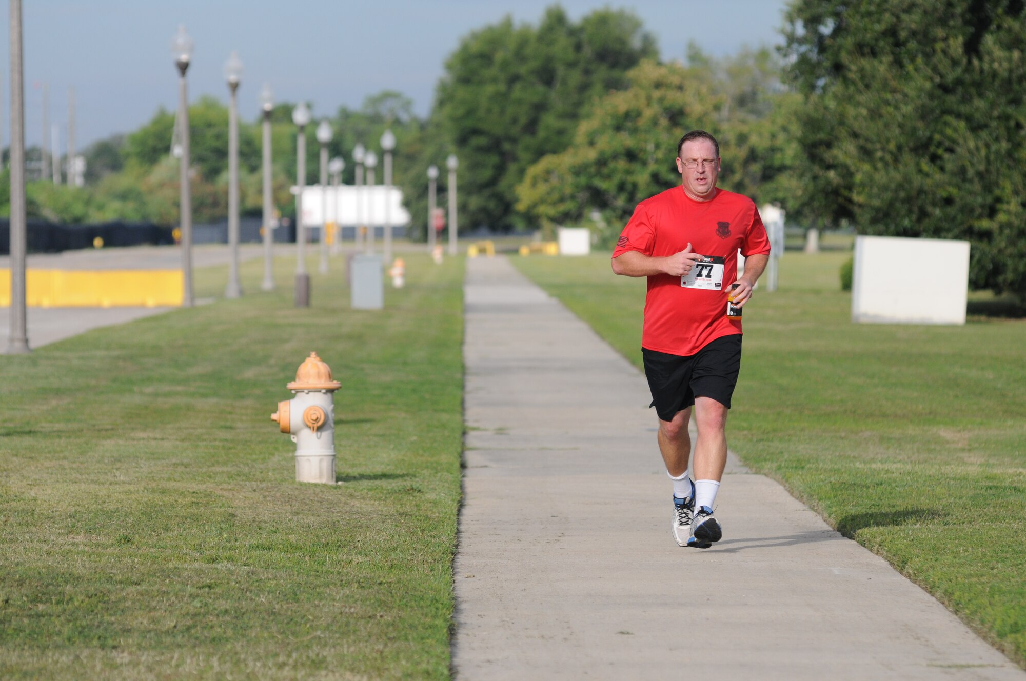 Tech. Sgt. Chad Quesenberry, 335th Training Squadron, nears the finish line as he completes the 2-mile run, the final event of Keesler's mini-triathlon Sept. 26, 2014, at Keesler Air Force Base, Miss.  The event also included a 9-mile bike ride and a 200-yard swim.  (U.S. Air Force photo by Kemberly Groue)
