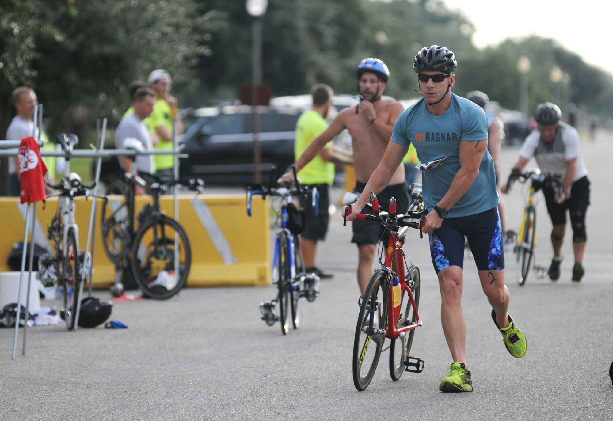 Master Sgt. Richard Crim, 81st Security Forces Squadron, completes the 9-mile bike ride during Keesler's mini-triathlon Sept. 26, 2014, at Keesler Air Force Base, Miss.  The event also included a 2-mile run and a 200-yard swim.  (U.S. Air Force photo by Kemberly Groue)