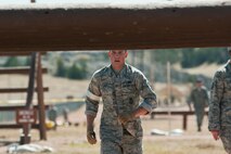 Airman 1st Class Marty Gray, 91st Security Forces Group Global Strike Challenge team member, runs to the next obstacle during the mental and physical challenge on Camp Guernsey Wyo., Sept. 25, 2014.  During the challenge, the team also competed in weapons firing and a tactics event. (U.S. Air Force photo/Senior Airman Brittany Y. Bateman)
