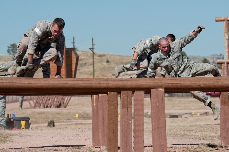 The 91st Security Forces Group Global Strike Challenge team competes in the mental and physical challenge on Camp Guernsey Wyo., Sept. 25, 2014. The security forces portion of the challenge was split into three different events; tactics, weapons firing, and the mental and physical challenge. (U.S. Air Force photo/Senior Airman Brittany Y. Bateman)
