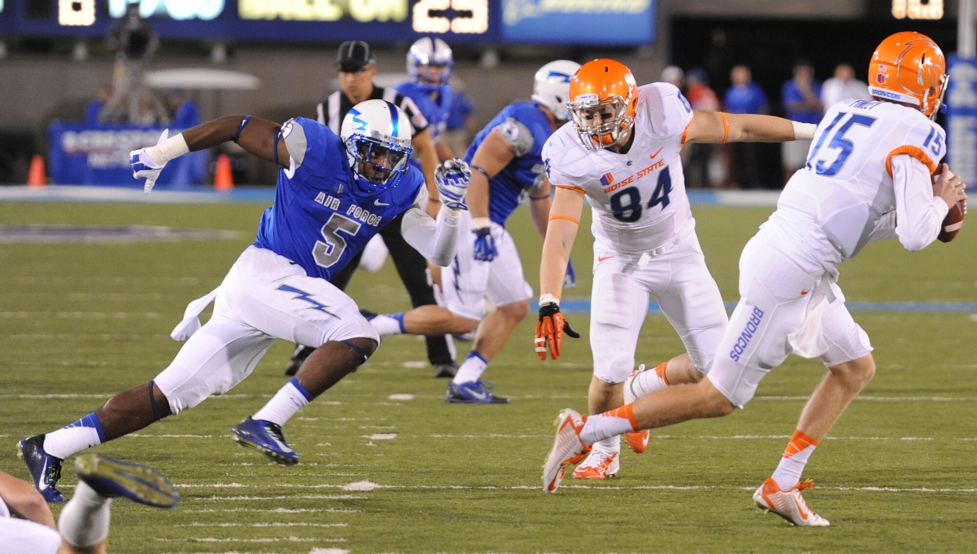Falcons outside linebacker Dexter Walker, left, rushes from the edge to push Boise State quarterback Ryan Finley out of the box.  Consistent pressure on the Boise State quarterbacks hurried the Broncos' passing attack and led to five interceptions by the Air Force defense, and a 28-14 Air Force victory.  The Falcons advance to 3-1 on the season and will host the 2-3 Navy Midshipmen Oct. 4.