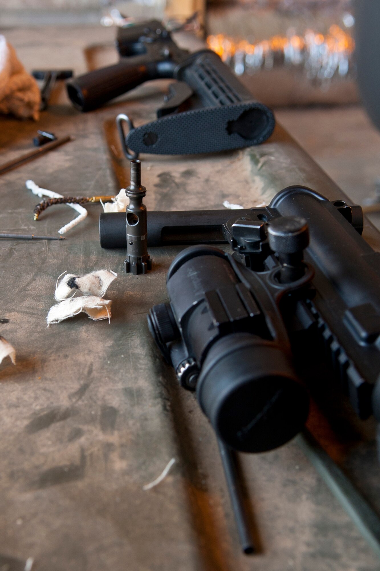 An M4 carbine lies on a cleaning table in the 307th RED HORSE Squadron compound at Barksdale Air Force Base, La., Sept. 11, 2014. More than 170 Airmen from both the 307th RHS and 307th Civil Engineer Squadron participated in a bivouac designed to complete yearly requirements in field and contingency skills training. (U.S. Air Force photo by Master Sgt. Jeff Walston/Released)