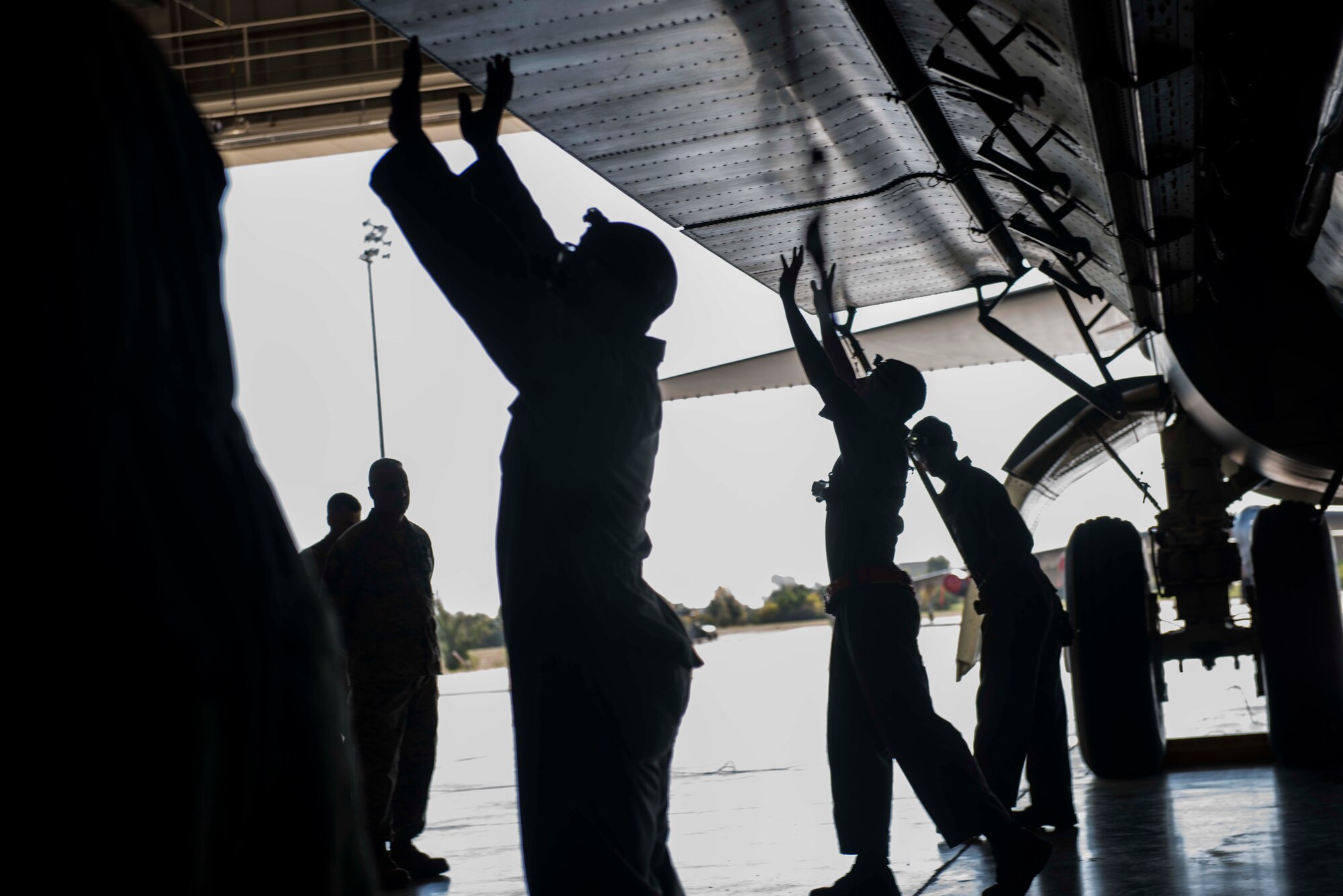 Members of the 5th Aircraft Maintenance Squadron lower the bomb bay doors on a B-52H Stratofortress during the Global Strike Challenge on Minot Air Force Base, Sept. 23, 2014. The four-man team competed in the challenge hoping to earn the title of best weapons load crew in Air Force Global Strike Command. (U.S. Air Force photo/ Airman 1st Class Lauren Pitts) 