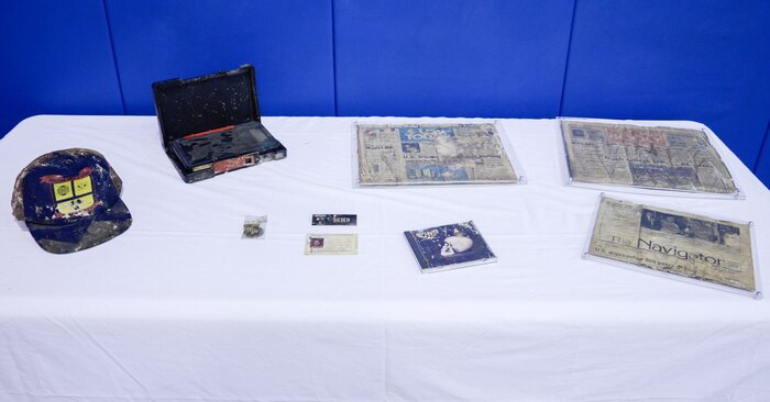 Sailors at the Naval Nuclear Power Training Command on Joint Base Charleston, S.C. retrieved a Time Capsule, Sept. 22, 2014, and displayed the contents during a ceremony in honor of the opening of the Bowman Center Multi-Purpose Room on the NNPTC Campus. Though slightly weathered, the contents, which were buried in 1989, were preserved well enough for today's student's to enjoy a blast from the past. (U.S. Navy photo/Petty Officer 3rd Class Gabriel Villareal)