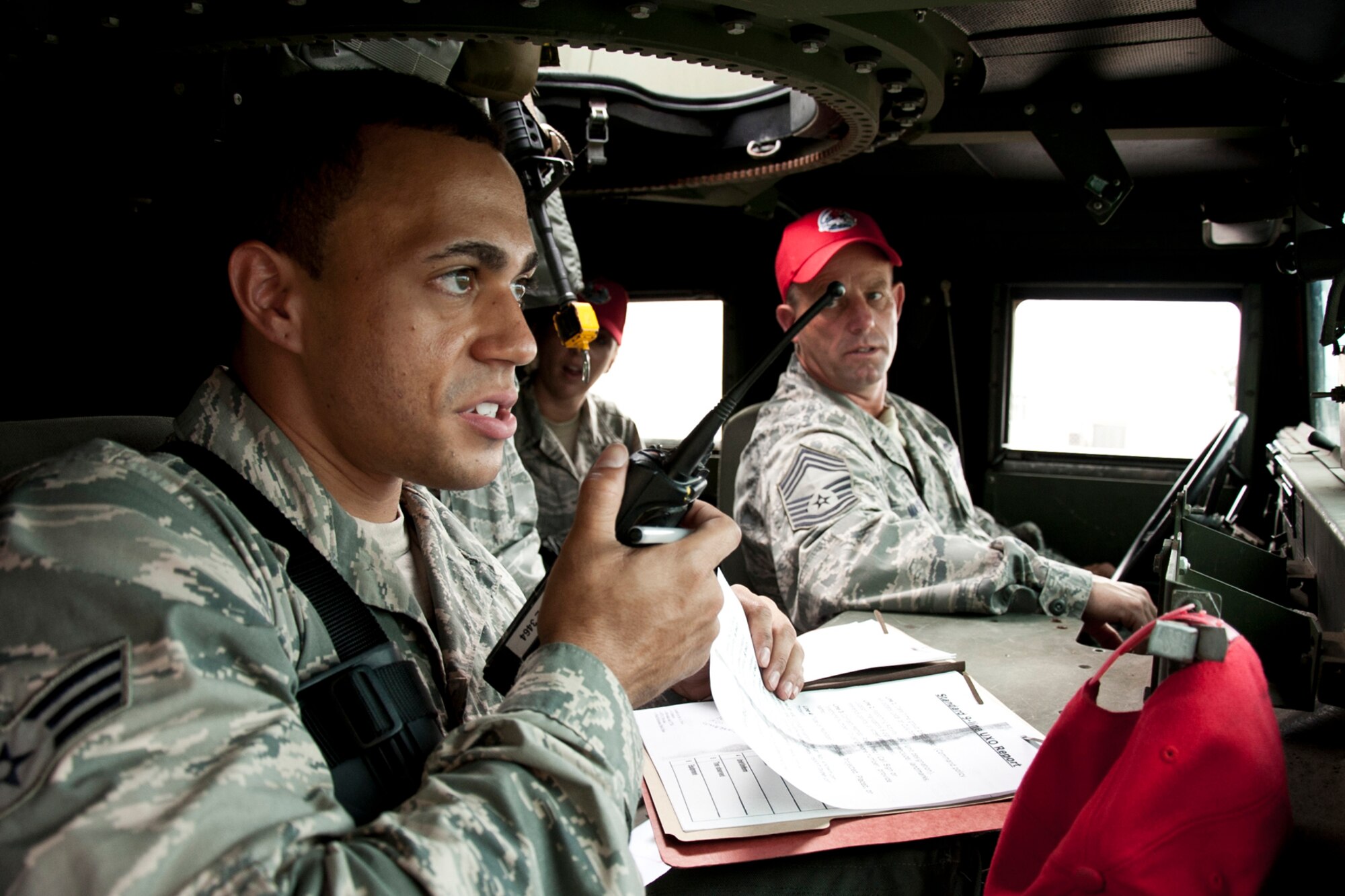 U.S. Air Force Senior Airman Andre Aviles, a heavy equipment operator assigned to the 307th RED HORSE Squadron, calls in a 9-Line request for support after finding a simulated unexploded ordnance device during an exercise at Barksdale Air Force Base, La., Sept. 10, 2014. More than 170 Airmen participated in a bivouac designed to complete yearly requirements in field and contingency skills training. (U.S. Air Force photo by Master Sgt. Jeff Walston/Released)