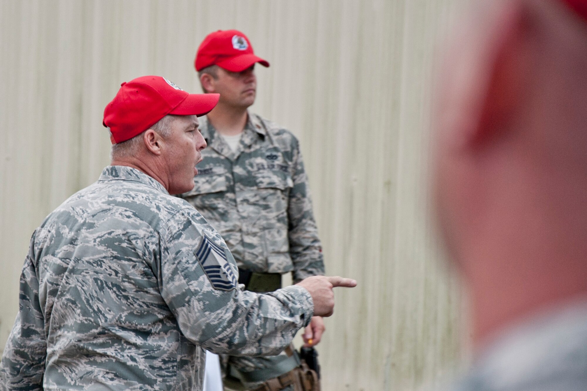 U.S. Air Force Chief Master Sgt. Rodney Kilby, chief of cantonment, 307th RED HORSE Squadron, addresses a formation of Airmen at Barksdale Air Force Base, La., Sept. 10, 2014. More than 170 Airmen participated in a bivouac designed to complete yearly requirements in field and contingency skills training. (U.S. Air Force photo by Master Sgt. Jeff Walston/Released)