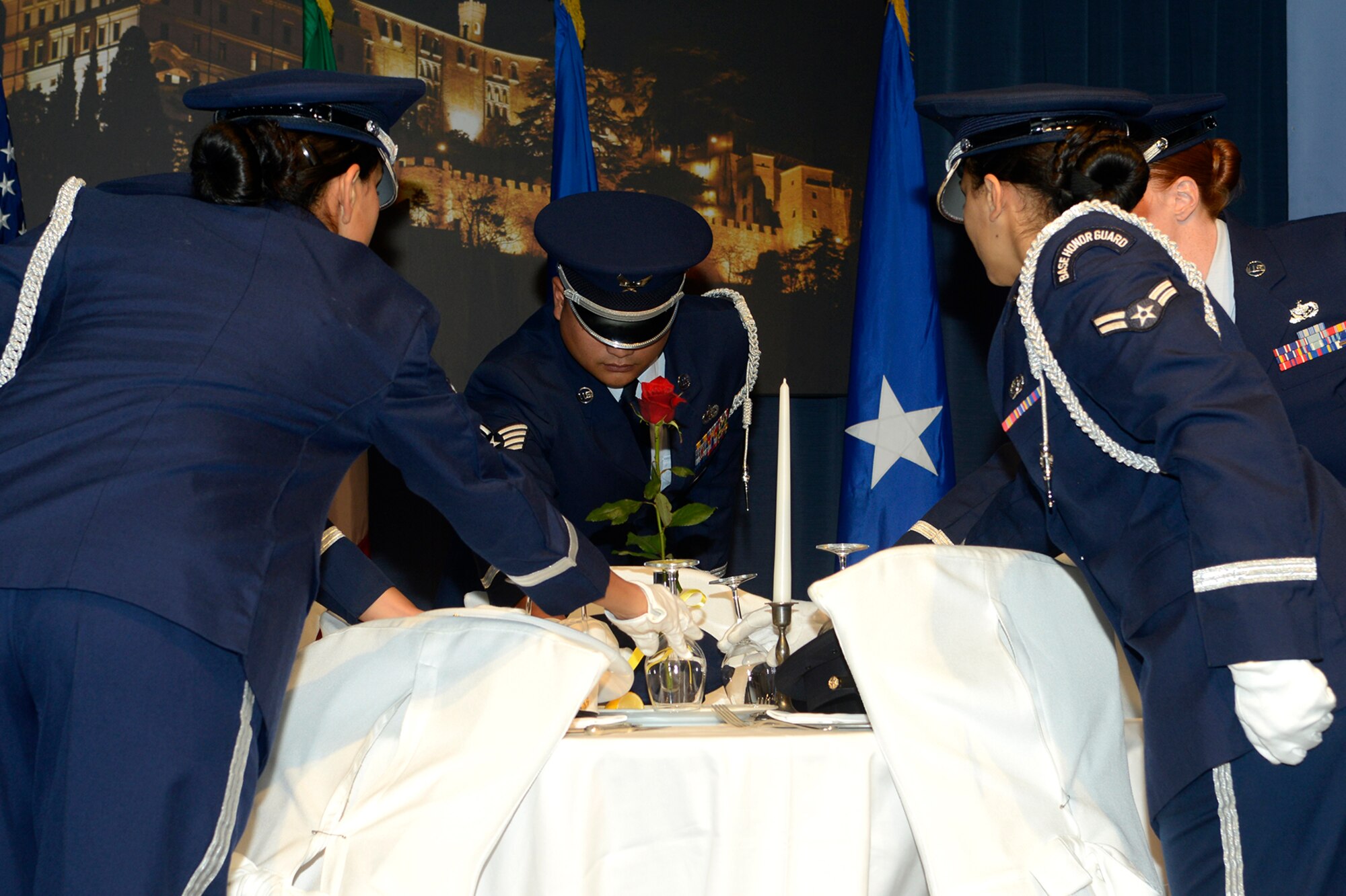 Members of the 31st Fighter Wing Honor Guard perform a Prisoner of War/Missing in Action ceremony during the 2014 Air Force Ball, Sept. 26, 2014, at Castel Brando. The ball, which is held each year in September, is in recognition of the U.S. Air Force separating from the U.S. Army and becoming an individual branch of the Armed Forces on Sept. 18, 1947. (U.S. Air Force photo/Staff Sgt. Jessica Hines)