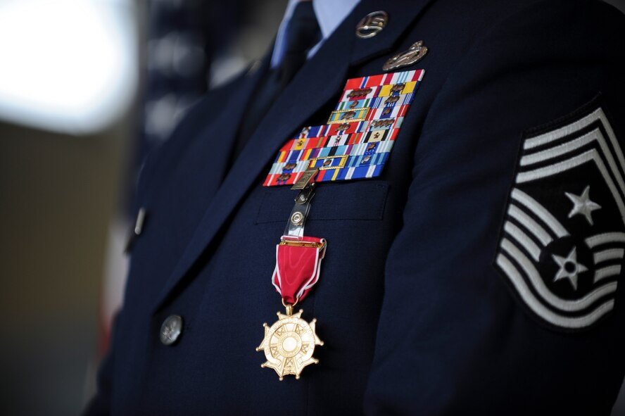 The Legion of Merit Medal hangs on the uniform of Chief Master Sgt. Michael Goetz, 93d Air Ground Operations Wing command chief, during his retirement ceremony Sept. 26, 2014, at Moody Air Force Base, Ga. The Legion of Merit is a  United States Armed Forces award given for exceptionally meritorious conduct in the performance of outstanding services and achievements. (U.S. Air Force photo by Andrea Jenkins/Released)