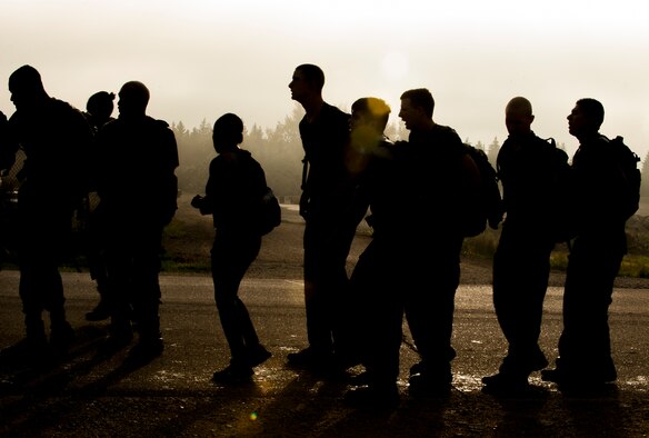 Team Minot Airmen participate in the GORUCK Light Team Cohesion Challenge on Minot Air Force Base, N.D., Sept. 24, 2014. The event, led by a GORUCK cadre, consisted of a five-hour ruck march that included several obstacles emulating special operations missions. (U.S. Air Force photo/Airman 1st Class Apryl Hall)