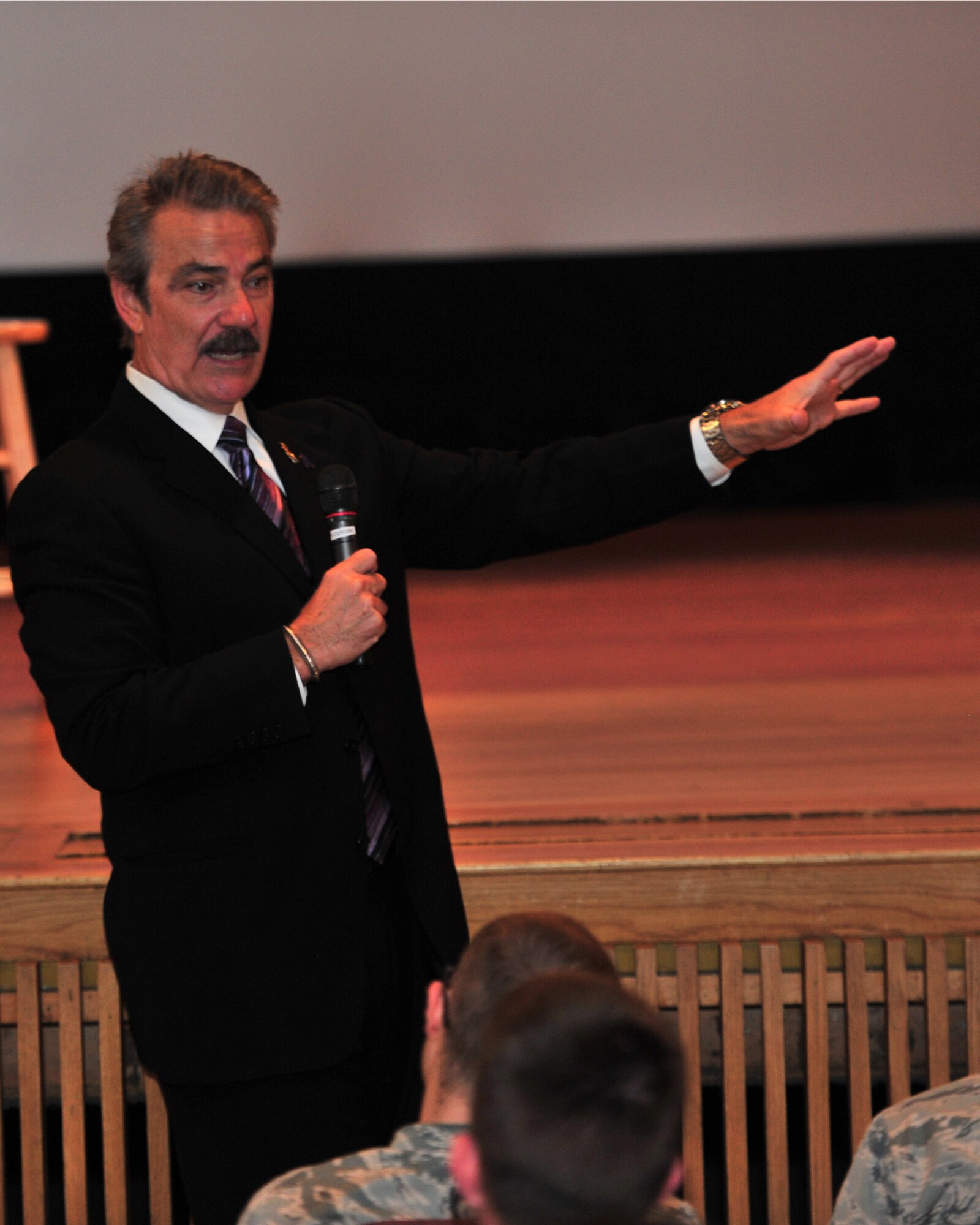 Victor Rivas Rivers; actor, author and domestic violence survivor, speaks to a crowd of Minot Air Force Base Airmen and family members during a presentation commencing Domestic Violence  Awareness month, Sept. 26, 2014. Rivers explained his struggle with domestic violence when he was a child, his eventual triumph over the abuse and how he was able to break the cycle. (U.S. Air Force photo/Senior Airman Andrew Crawford)