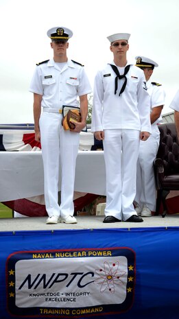 Ens. Rory Loughran and Petty Officer 3rd Class William Bowes, are recognized as the Naval Nuclear Power Training Command's Honor Graduates for class 1404 during a graduation ceremony at NNPTC, Sept. 26, 2014, at Joint Base Charleston, S.C. (U.S. Navy photo/Petty Officer 2nd Class Jason Pastrick)