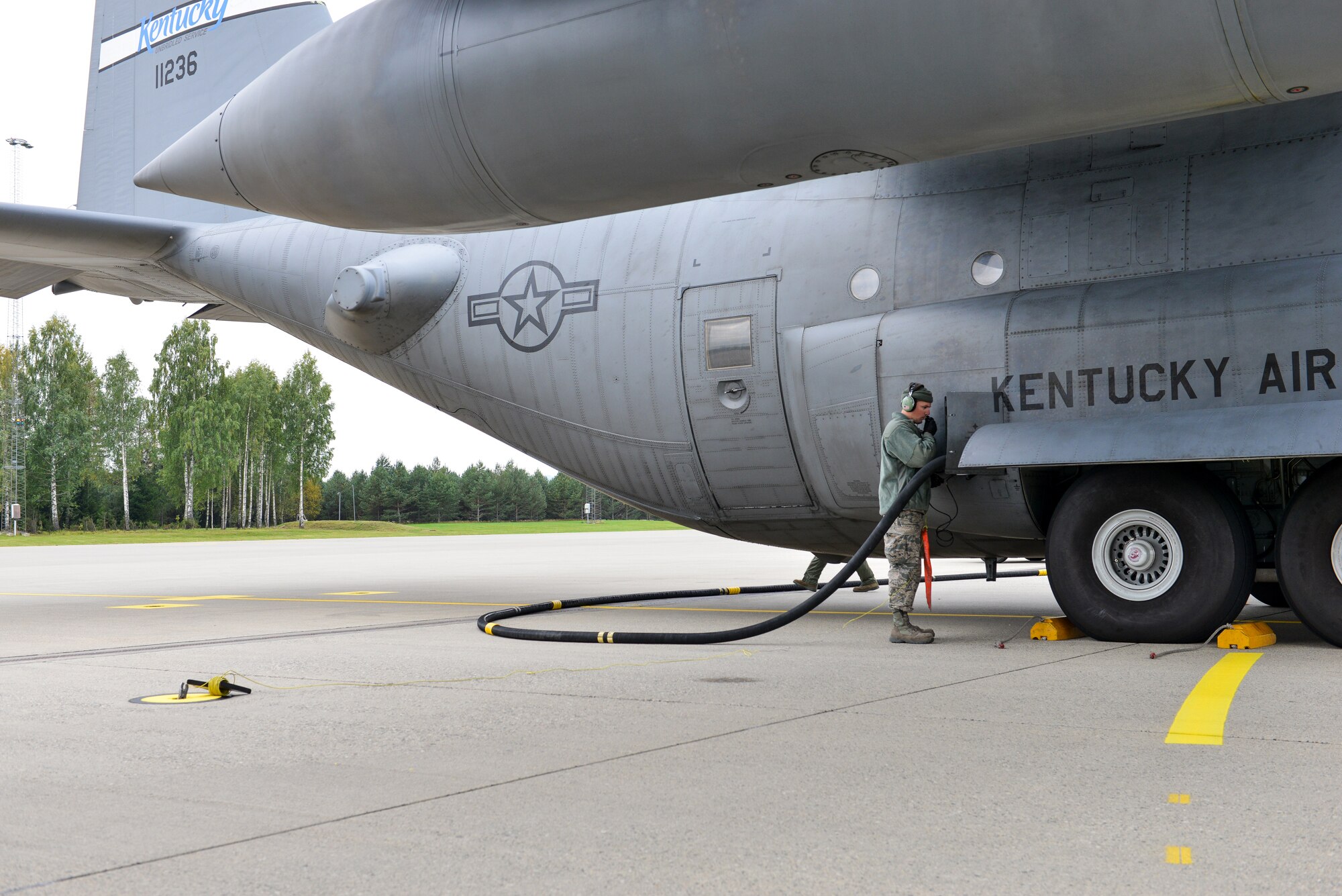 U.S. Air Force Master Sgt. Greg Howard, a crew chief from the Kentucky Air National Guard’s 123rd Maintenance Squadron, refuels a C-130H aircraft prior to take off Sept. 23, 2014, at Gardermoen Military Air Station in Oslo, Norway. Howard and Airmen from the Kentucky Air Guard’s 123rd Airlift Wing provided airlift support to the 82nd Airborne Division during Operation Noble Ledger. (U.S. Air National Guard photo by Master Sgt. Charles Delano)