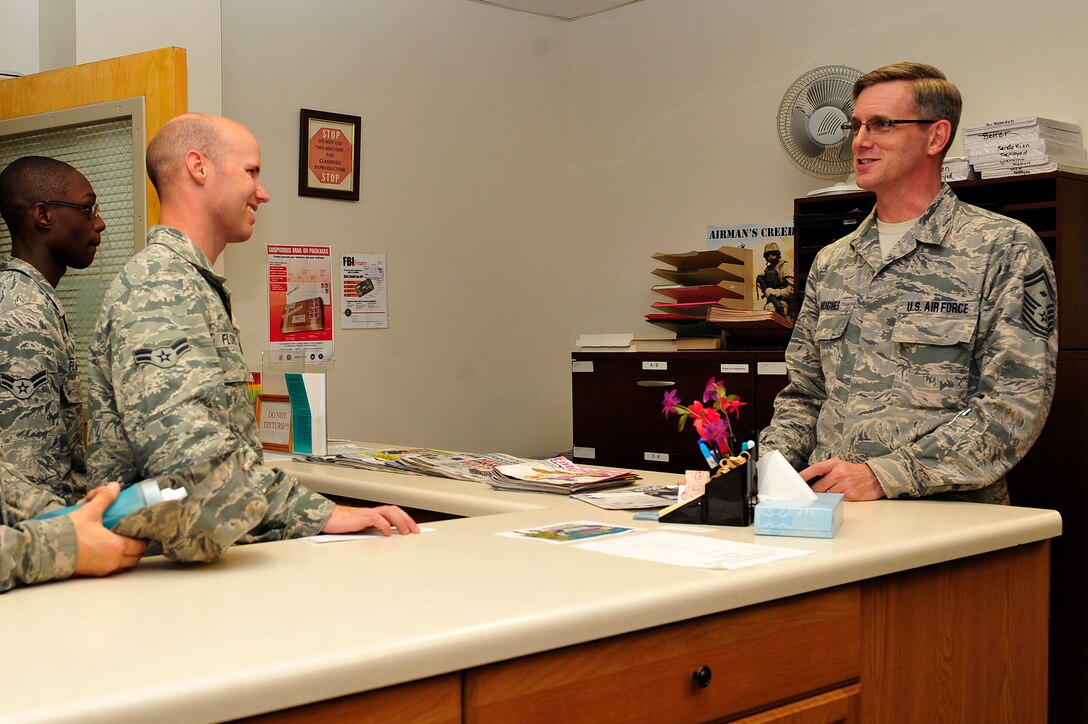 U.S. Air Force Senior Master Sgt. Derek Hughes, 633rd Logistics Readiness Squadron first sergeant, speaks with Airmen participating in the Airmen Exchange Program about the orderly room process at Langley Air Force Base, Va., Sept. 29, 2014. The Airmen Exchange Program gives Airmen the opportunity to learn about the 633rd LRS and all its components, such as quality assurance, mobility and deployments. (U.S. Air Force photo by Airman 1st Class Breonna Veal/ Released)
