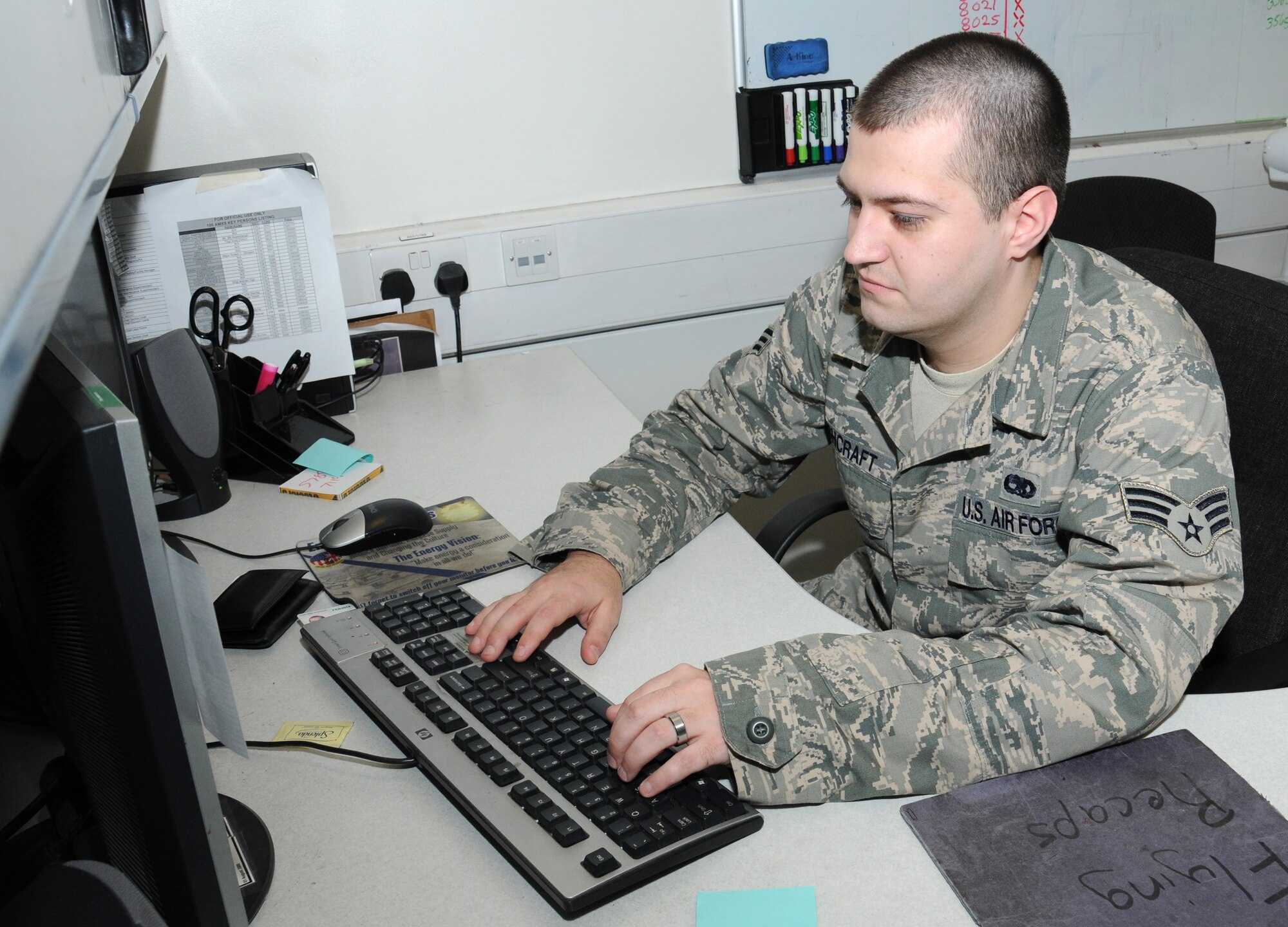 U.S. Air Force Senior Airman Justin Ashcraft, 100th Aircraft Maintenance Squadron debrief and supply focal point technician from Pine Bluff, Ark., ensures forms match in the management information system so the plane is ready to take off Sept. 12, 2014, on RAF Mildenhall, England. The section is a liaison between the aircrew when they land and maintenance personnel before they get the forms back to the jet. (U.S. Air Force photo/Gina Randall/Released)