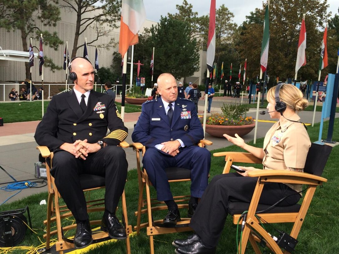 Air Force Lt. Gen. Douglas J. Robb, center, director of the Defense Health Agency, and Navy Command Master Chief Petty Officer Terry J. Prince, far left, senior enlisted advisor for DHA, discuss the agency’s overall mission and role during an interview with Navy Petty Officer 1st Class Brandie Wills, host of DoD News’ Adaptive Warrior broadcast, at the Warrior Games in Colorado Springs, Colo., Sept. 28, 2014. DoD photo by Army Sgt. 1st Class Tyrone C. Marshall Jr.