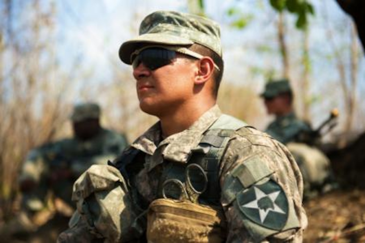 Army Pvt. Juan Gonzalez, a rifleman assigned to 2nd Battalion, 1st Infantry Regiment, 2nd Stryker Brigade Combat Team, 2nd Infantry Division, performs security duties during patrol base operations for the Garuda Shield field training exercise, Sept. 8, 2014, in East Java, Indonesia. U.S. Army photo by Sgt. Brooks Fletcher