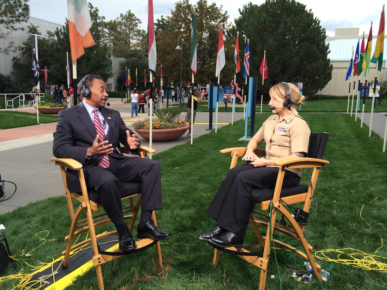 Jonathan Woodson, left, assistant secretary of defense for health affairs, discusses the evolution of military medical care and benefits of the adaptive sport program with Navy Petty Officer 1st Class Brandie Wills, host of DoD News’ Adaptive Warrior broadcast, at the Warrior Games in Colorado Springs, Colo., Sept. 28, 2014. DoD photo by Army Sgt. 1st Class Tyrone C. Marshall Jr.