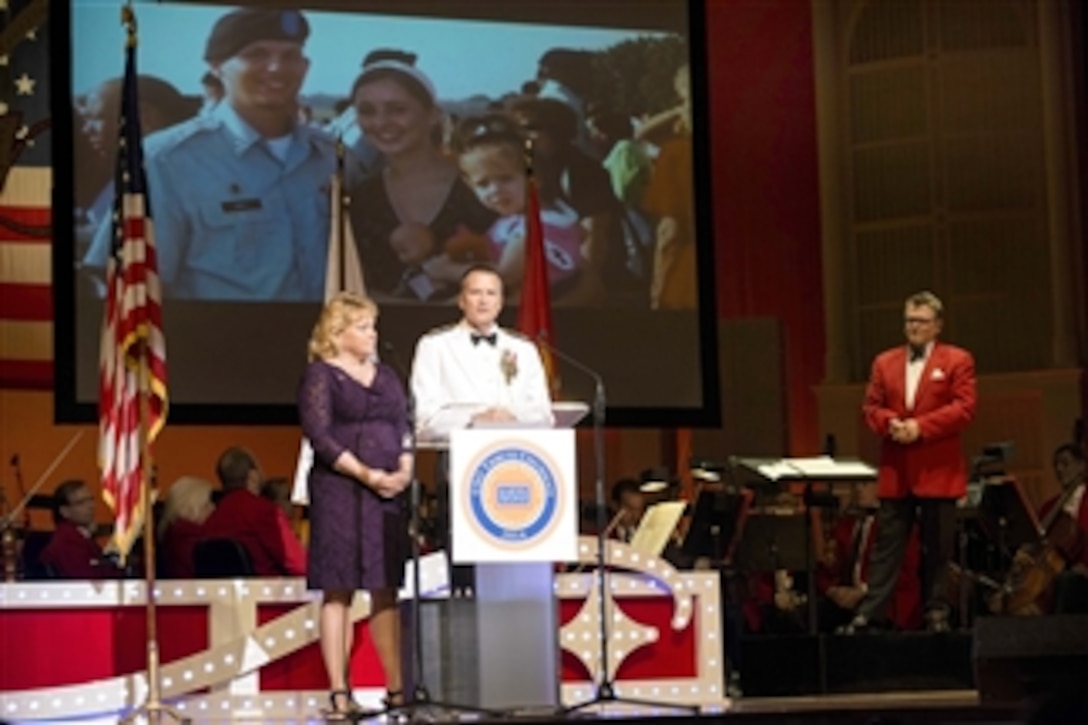 Navy Adm. James A. Winnefeld Jr., vice chairman of the Joint Chiefs of Staff, and his wife, Mary, introduce 2014 USO Tribute Cincinnati honoree Katy Hines during the USO Tribute Gala in Cincinnati, Sept. 28, 2014. The annual event honored troops and military families.