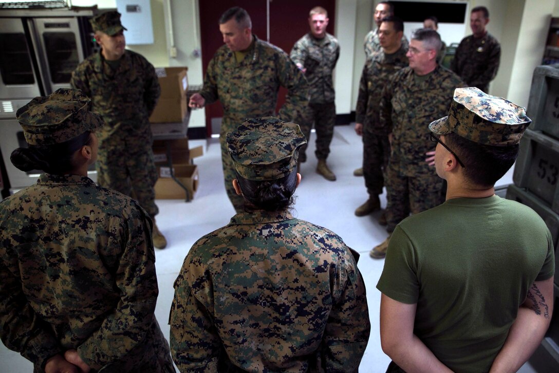 III Marine Expeditionary Force commanding general, Lt. Gen. John Wissler, awards Sgt. Edward R. Martinez III, a Livermore, California, native, with a Navy Achievement Medal at the Camp Mujuk Expeditionary Chow Hall in the Republic of Korea, March 22. Martinez, the mess chief and substance chief, received the medal for outstanding food services during Exercise Key Resolve and Combined Marine Component Command, Command Post Exercise. Martinez is a food service specialist with III MEF Headquarters Group, III MEF. 