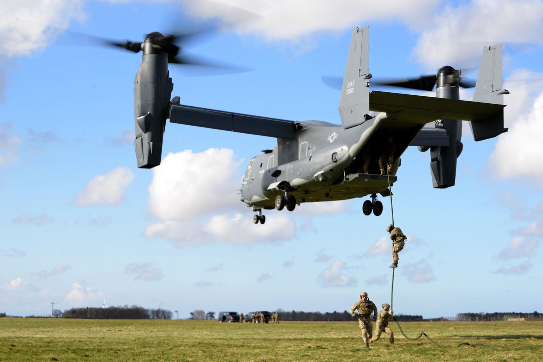 Members of the 321st Special Tactics Squadron fast rope out of a CV-22B Osprey assigned to the 7th Special Operations Squadron March 25, 2015, at RAF Sculthorpe in Norfolk, England. The Special Tactics Air Commandos regularly train on how to infiltrate a potentially hostile area – through Fast Rope Insertion Extraction System or high-altitude, low-opening entries. (U.S. Air Force photo by Tech. Sgt. Stacia Zachary)