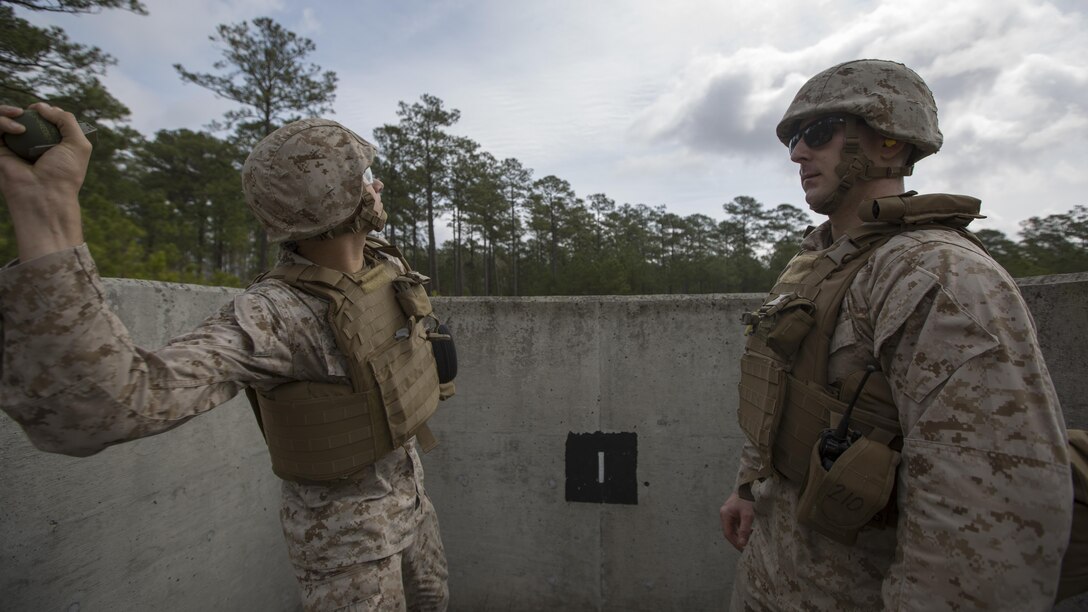 Private First Class Trent Sapper, an auto maintenance technician with Engineer Support Company, 8th Engineer Support Battalion, throws an M67 fragmentation grenade into the impact area aboard Camp Lejeune, N.C. March 27, 2015. Approximately 80 Marines from the company successfully threw M67 fragmentation grenades at the range without any training mishaps. 