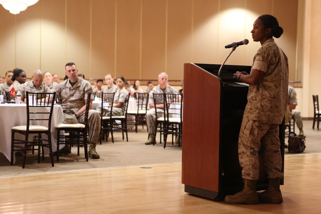 Sergeant Maj. Jennifer L. Simmons, the sergeant major of Wounded Warrior Battalion West, speaks at a women’s leadership symposium aboard Marine Corps Base Camp Pendleton, Calif., March 30, 2015. The symposium gave junior Marines a chance to speak to prominent military leaders to discuss gender equality and other topics.