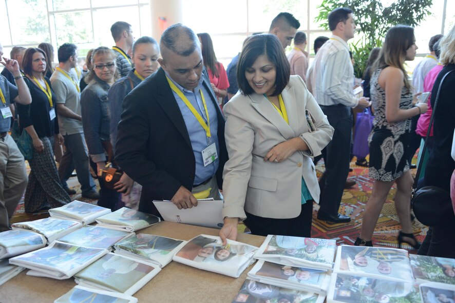 A couple attending a Yellow Ribbon event in Florida picks up their pillowcase that was prepared by key spouses. The program can help bridge the emotional distance for families who are about to deploy. (Air Force photo/Master Sgt. Chance Babin)