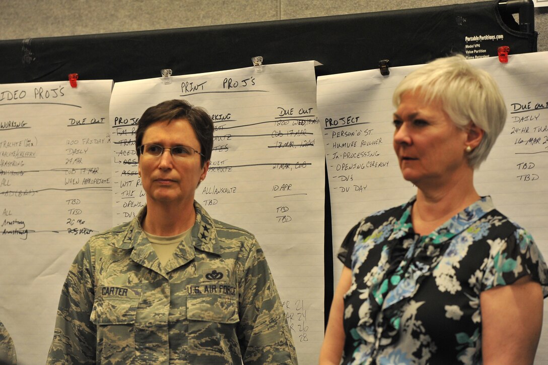 FORT BLISS, Texas – At left, U.S. Air Force Maj. Gen. Theresa Carter, Air Force Installation and Mission Support Center (Provisional) commander from Joint Base Andrews Naval Air Facility Washington, Maryland, receives a briefing with Frances Sullivan, assistant deputy commandant, Installations and Logistics, during the 2015 Operational Contract Support Joint Exercise here March 27. The goals of the joint, combined exercise are to create shelf-ready operational contract support products for future operations, improve OCS capabilities and increase senior leader OCS awareness and involvement. (U.S. Air Force photo/Staff Sgt. Veronica Montes/Released)