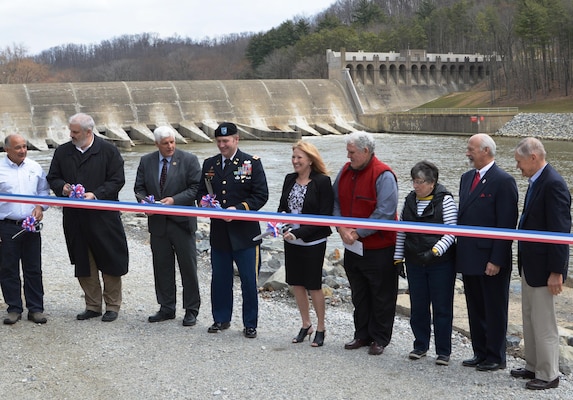With the Dam Safety Assurance Program work to reduce risk at Dover Dam officially complete, the Huntington District, U.S. Army Corps of Engineers hosted a ribbon cutting ceremony at Dover Dam to mark the occasion.