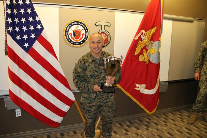 Major Jackson T. Doan, operations officer, Edson Range, Weapons Field Training Battalion, receives an award for Athlete of the Year during a ceremony held at Edson Range, Camp Pendleton. He competed in the 2014 U.S Nationals, the U.S. world team trials in 2014 and represented the U.S. for the Fila Pankration World Championship in the 145-pound weight class earning two gold medals, a silver and bronze. 