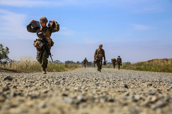 Recruits of Hotel Company, 2nd Recruit Training Battalion, sprint approximately 100 yards with two ammunition cans during the 12 stalls event at Edson Range, Marine Corps Base Camp Pendleton, March 31. Each station had a different set of rules to follow, but one rule that stayed the same was recruits could not touch anything on the obstacle painted red or it simulated they a casualty, requiring them to restart the obstacle. Company H is scheduled to graduate from recruit training, April 3.