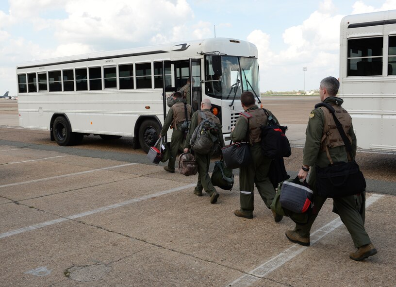 In support of a long-range mission to the Arctic and North Sea regions, aircrews from the 2nd and 307th Bomb Wings board a bus that will take them to their B-52H Stratofortress aircraft on Barksdale Air Force Base, La., April 1, 2015. Called "Polar Growl," the mission will help ensure the bomber crews maintain a high state of readiness and proficiency and demonstrate their ability to provide a flexible and always-ready, global-strike capability. (U.S. Air Force photo/Airman 1st Class Curt Beach)