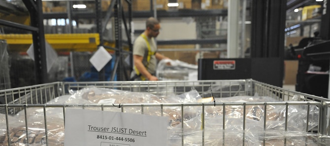 Staff Sgt. Micheal Heger, 92nd Logistics Readiness Squadron individual protective equipment supervisor, counts uniform items during an inventory March 26, 2015, at Fairchild Air Force Base, Wash. The material management flight maintains an adequate supply of gear to fulfill deployment and training requirements. (U.S. Air Force photo/Staff Sgt. Samantha Krolikowski)
